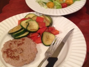 Turkey burger, veggies, and salad with just a few tomatoes. 